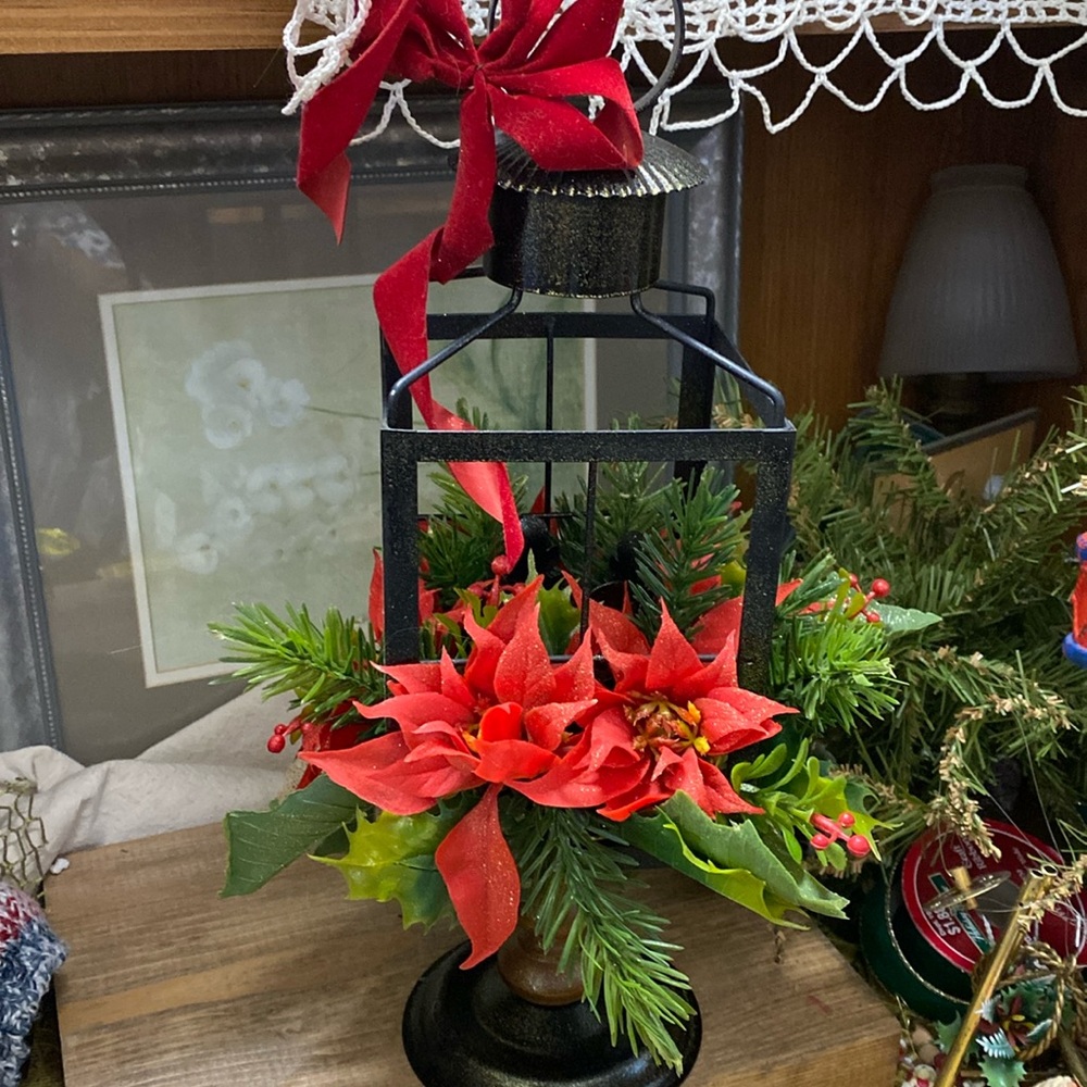 Vintage lantern with plastic Christmas flowers